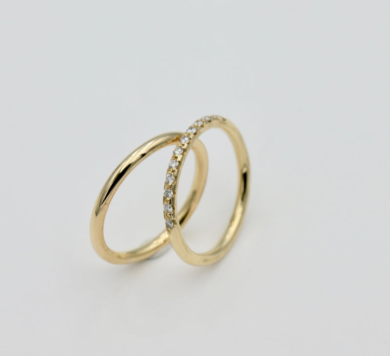 Two round wire bands together one diamond set 